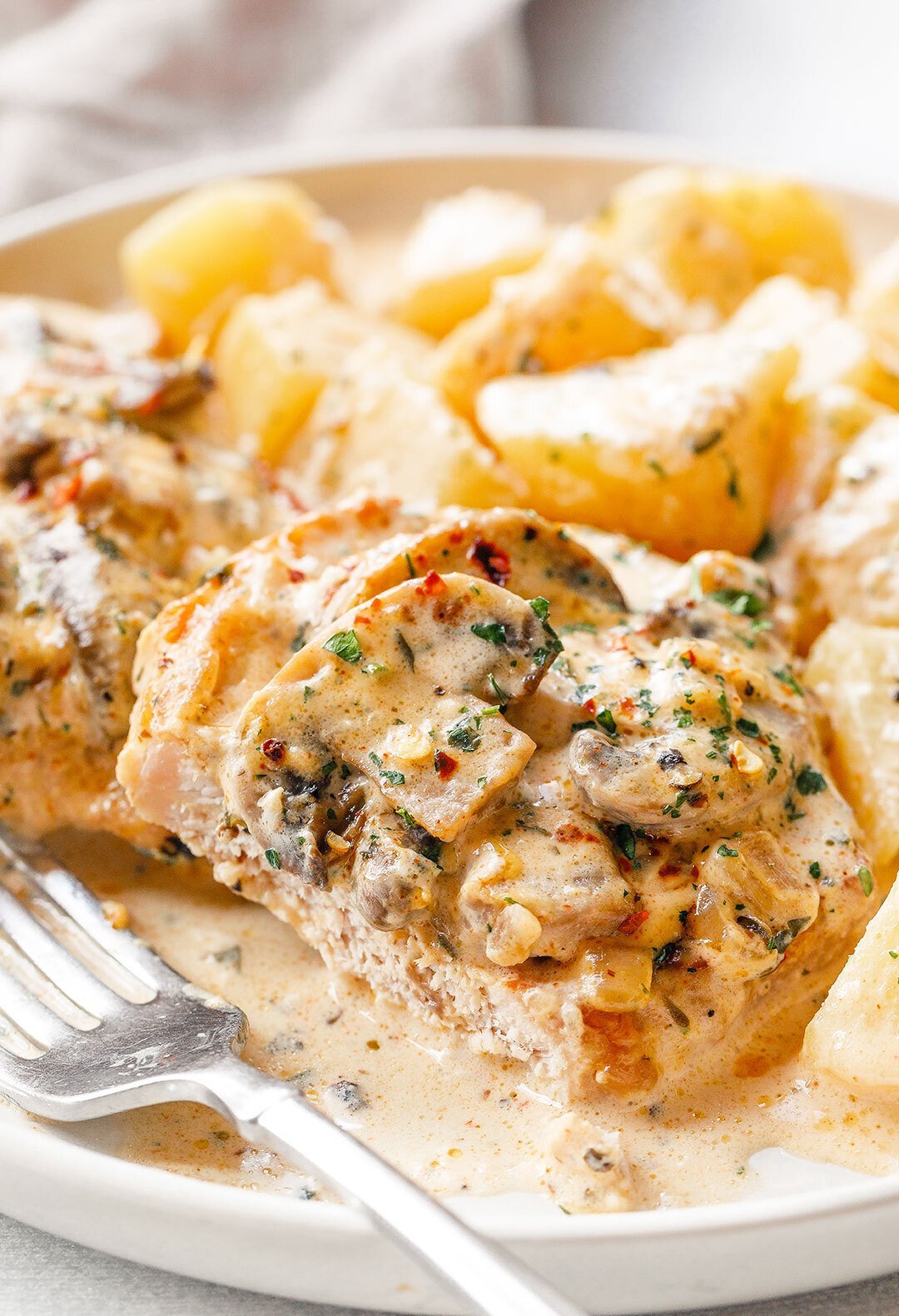 Crockpot Creamy Garlic Pork Chops with Mushrooms and Potatoes